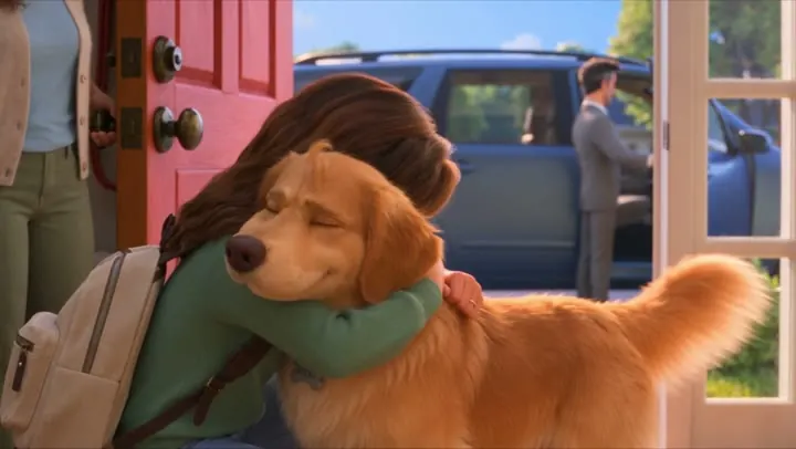 Dog memorial video still: a golden retriever hugging his girl at the door